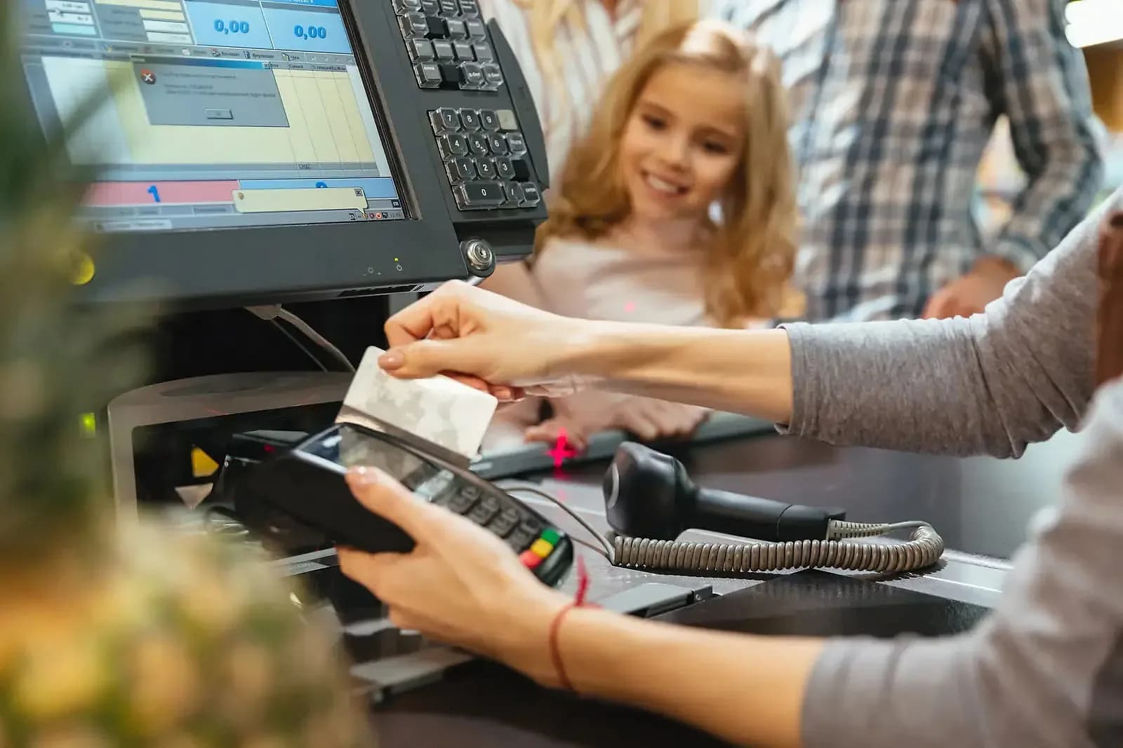 Customer paying by card at a retail checkout running Pacific POS